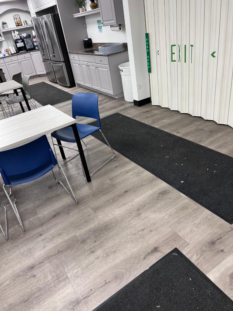Commercial breakroom and common area before service — no people. Photo 6 of 12.