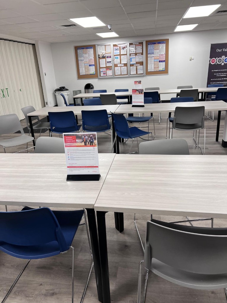 Commercial breakroom and common area before service — no people. Photo 11 of 12.