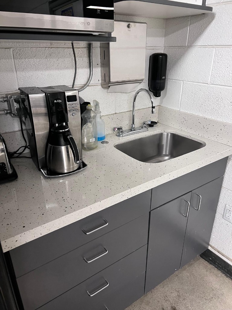 Industrial breakroom and common area after service — no people. Photo 3 of 4.