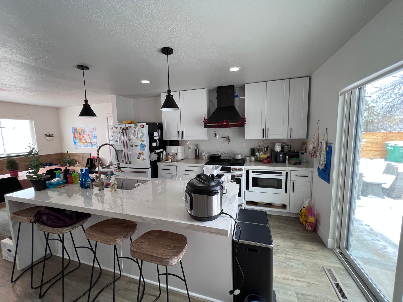 Dishwashing and kitchen sink area after cleaning with clearer counter space.